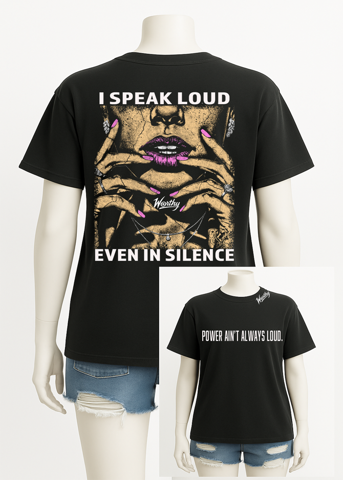 Let your silence speak volumes. This bold black tee features a striking back graphic of a woman’s face and hands, framed by the words “I Speak Loud Even In Silence.” The front delivers a powerful reminder: “Power Ain’t Always Loud,” with the Worthy logo stamped at the collar. Made for those who don't need to shout to be heard.